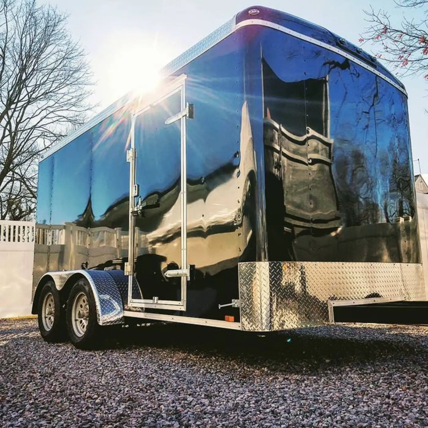 The DJC enclosed equipment trailer parked on gravel at first light